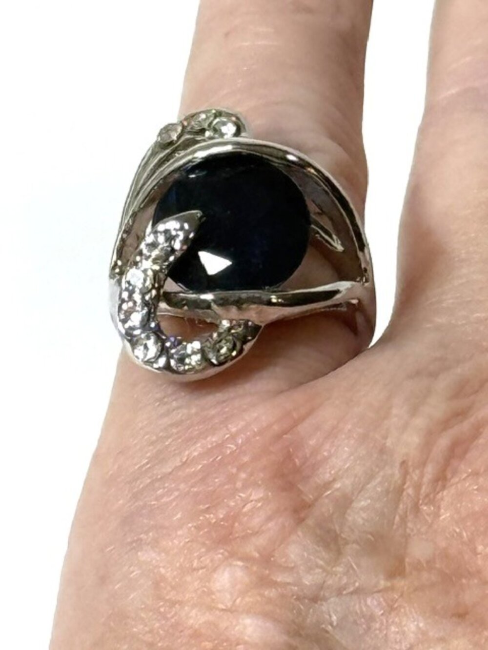 Sapphire-colored stone, silver-tone fashion statement ring.